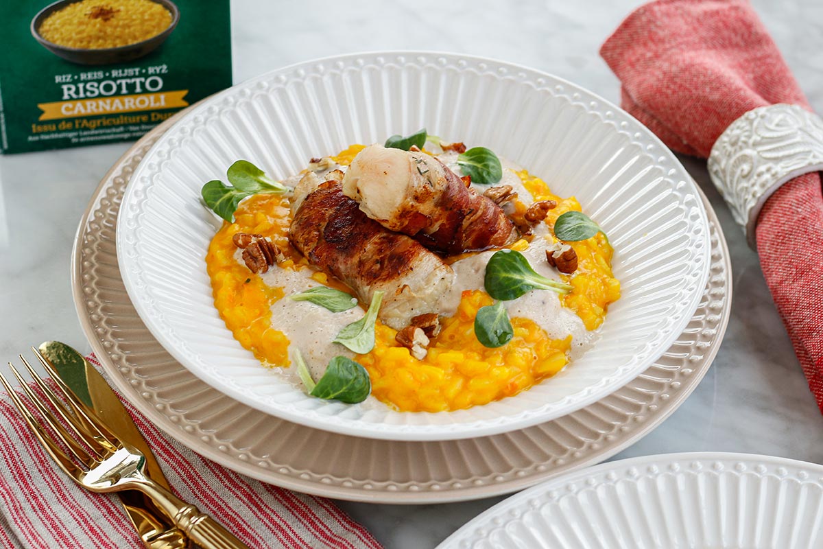 Geröstetes Kürbisrisotto mit in Speck gebratenen Welsfilet und Maronischaum